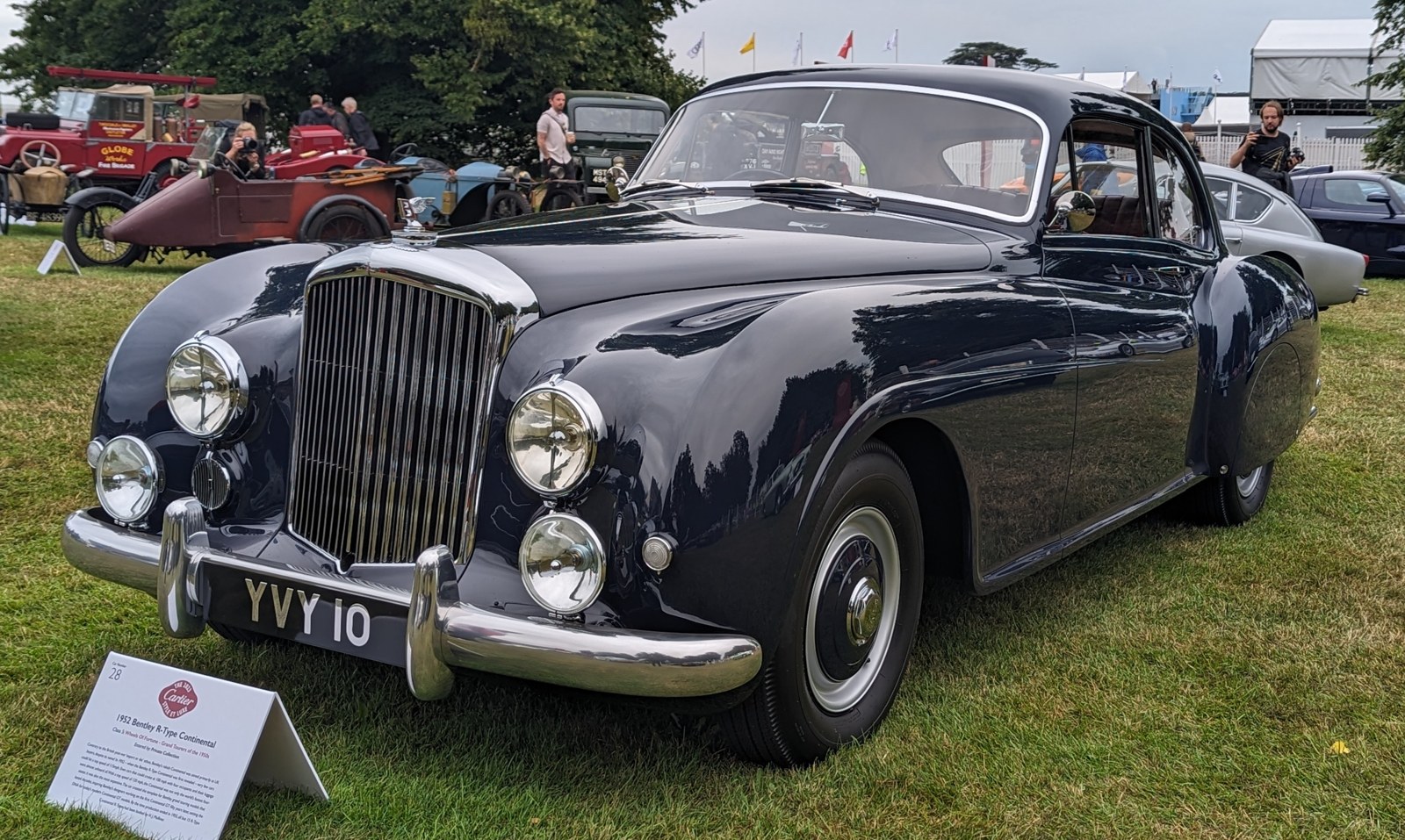 A Bentley R-Type Continental seen from the front and side.